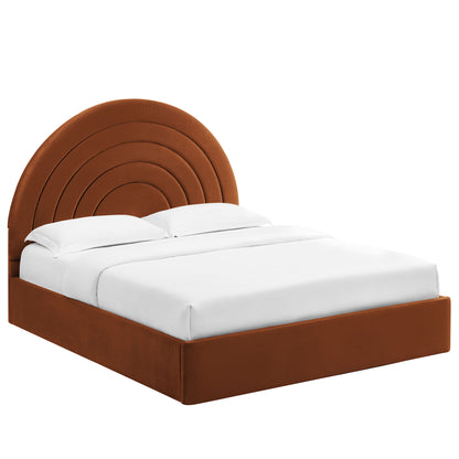 Brown upholstered platform bed with a large curved segmented arc headboard and white bedding.