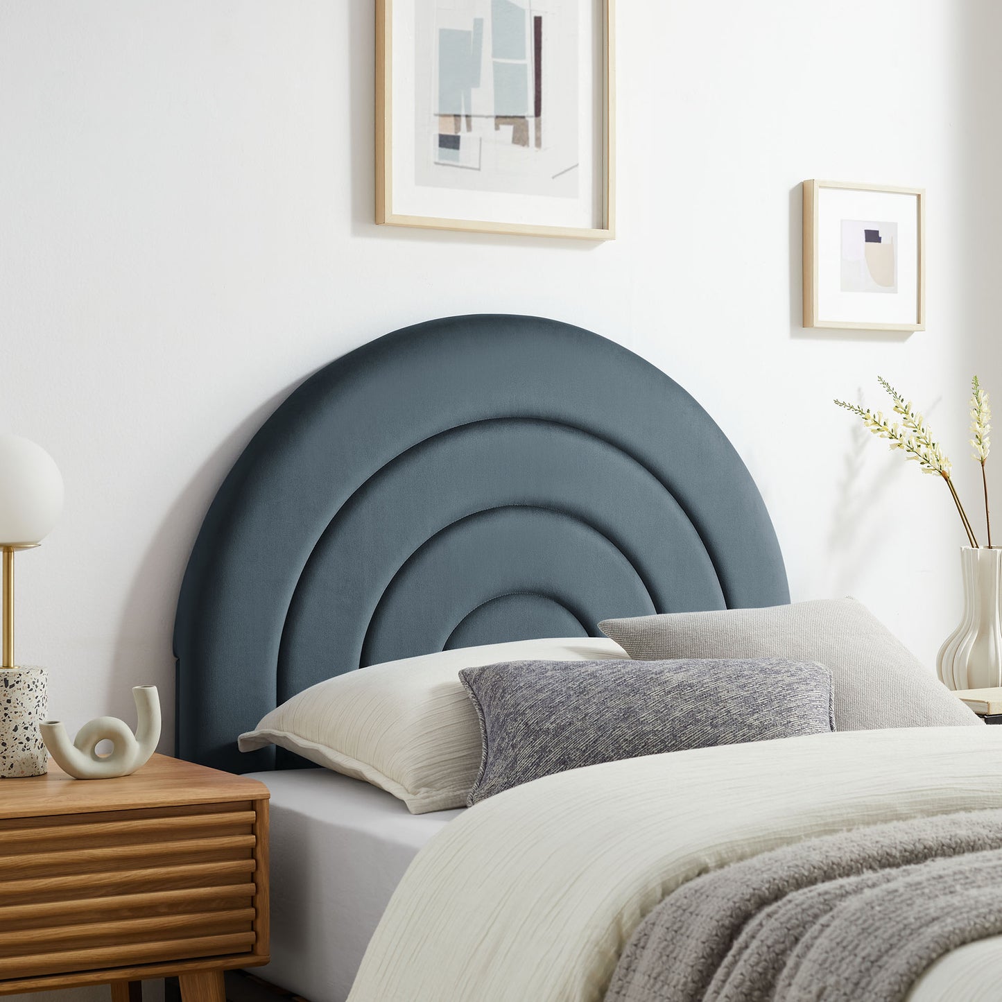 Twin headboard in navy blue velvet with an arched upholstered panel