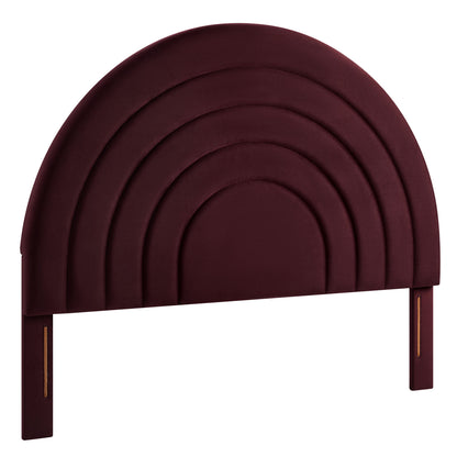 Burgundy velvet arched headboard with concentric nested arches and wood posts with brass accents.