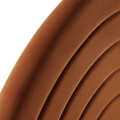 Cognac brown arched velvet headboard with a padded, curved silhouette.