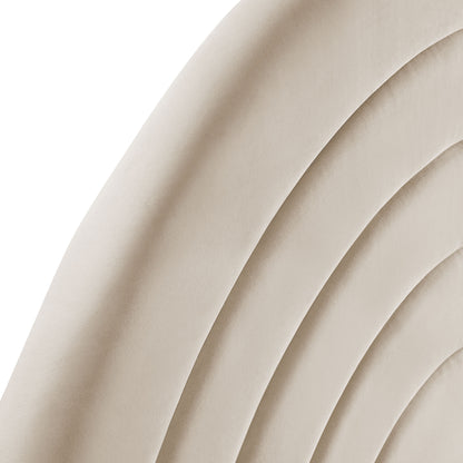 Oatmeal velvet arched headboard with curved quilted upholstery featuring concentric channel stitching.