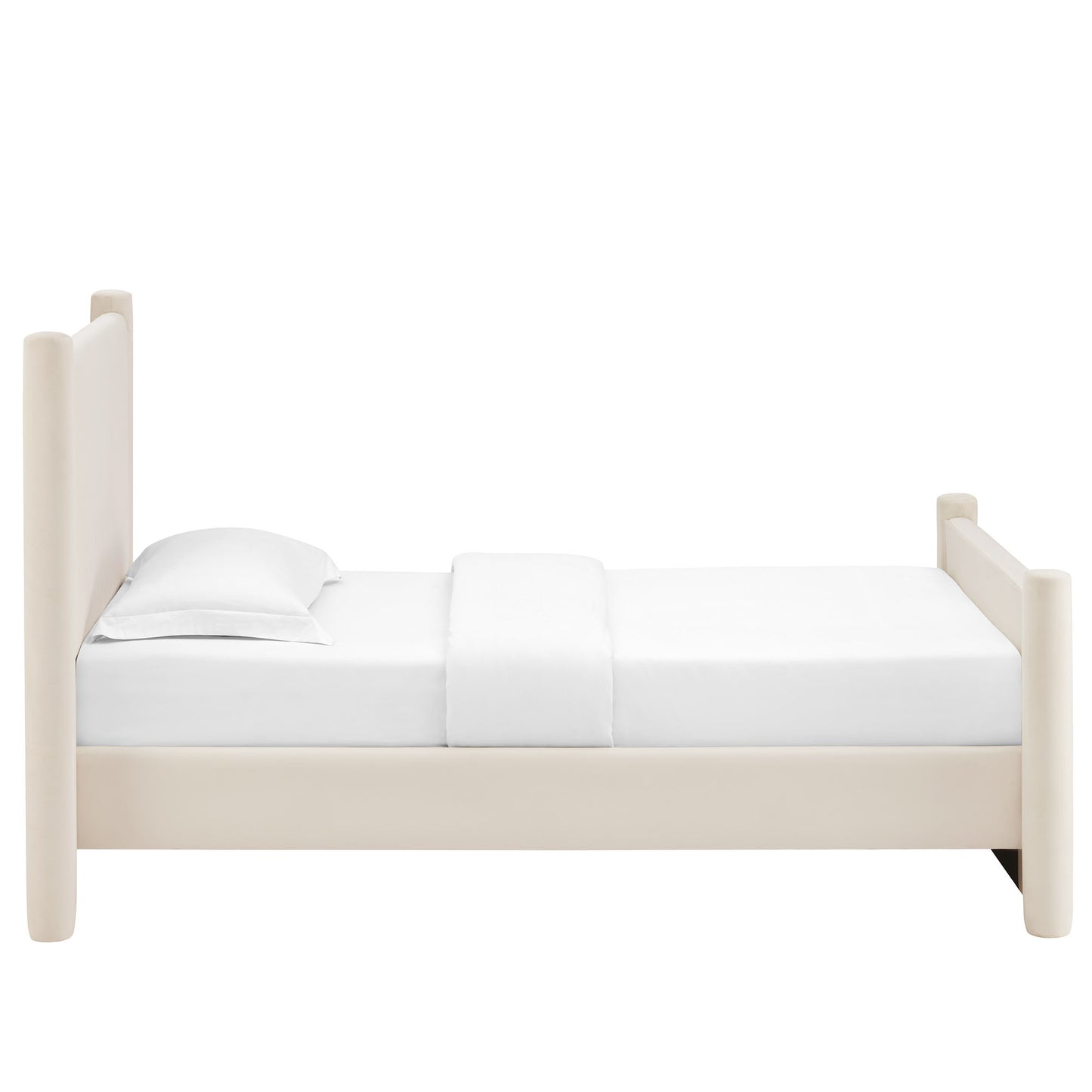 Ivory velvet upholstered twin platform bed with a white mattress and pillows.