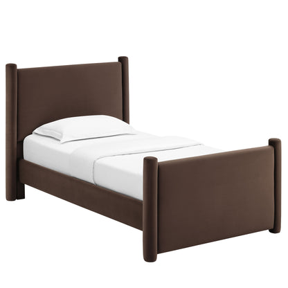 Brown upholstered twin bed with tall headboard and rounded posts, white sheets.
