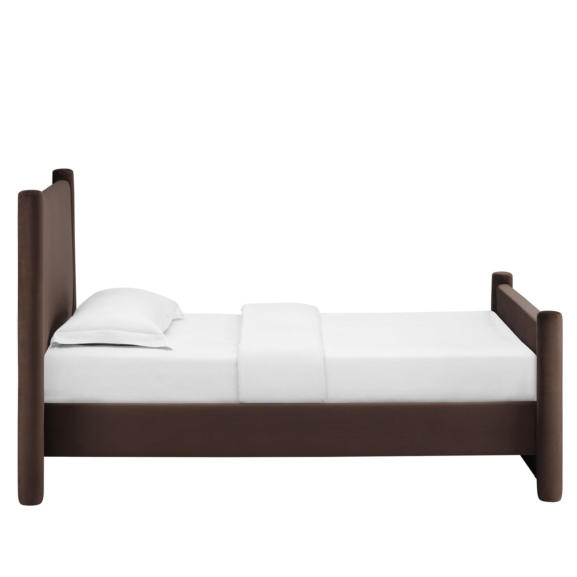Dark brown velvet twin platform bed with tall rounded posts and white bedding.