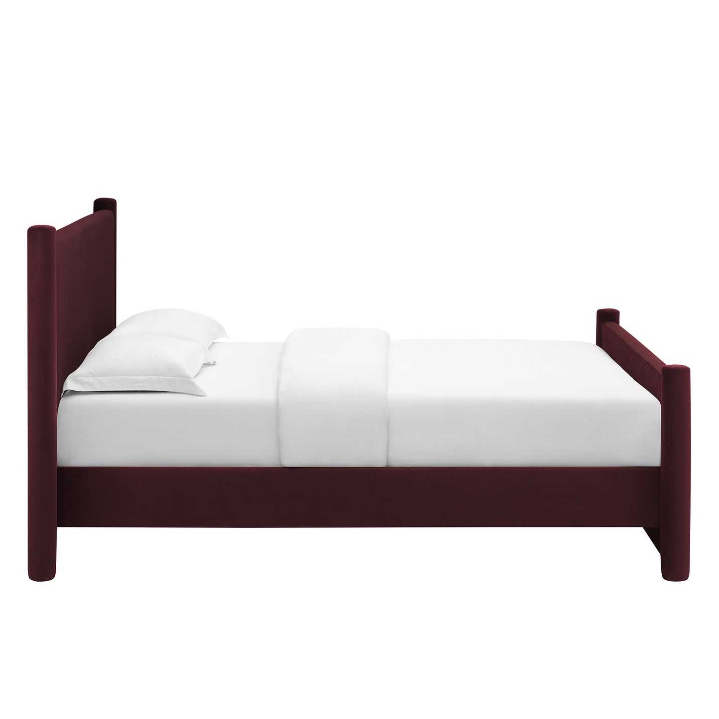 Purple velvet queen platform bed with a tall upholstered headboard, with a white mattress and pillows.