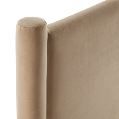 Taupe velvet sofa arm with a rounded cylindrical armrest and upholstered back panel.