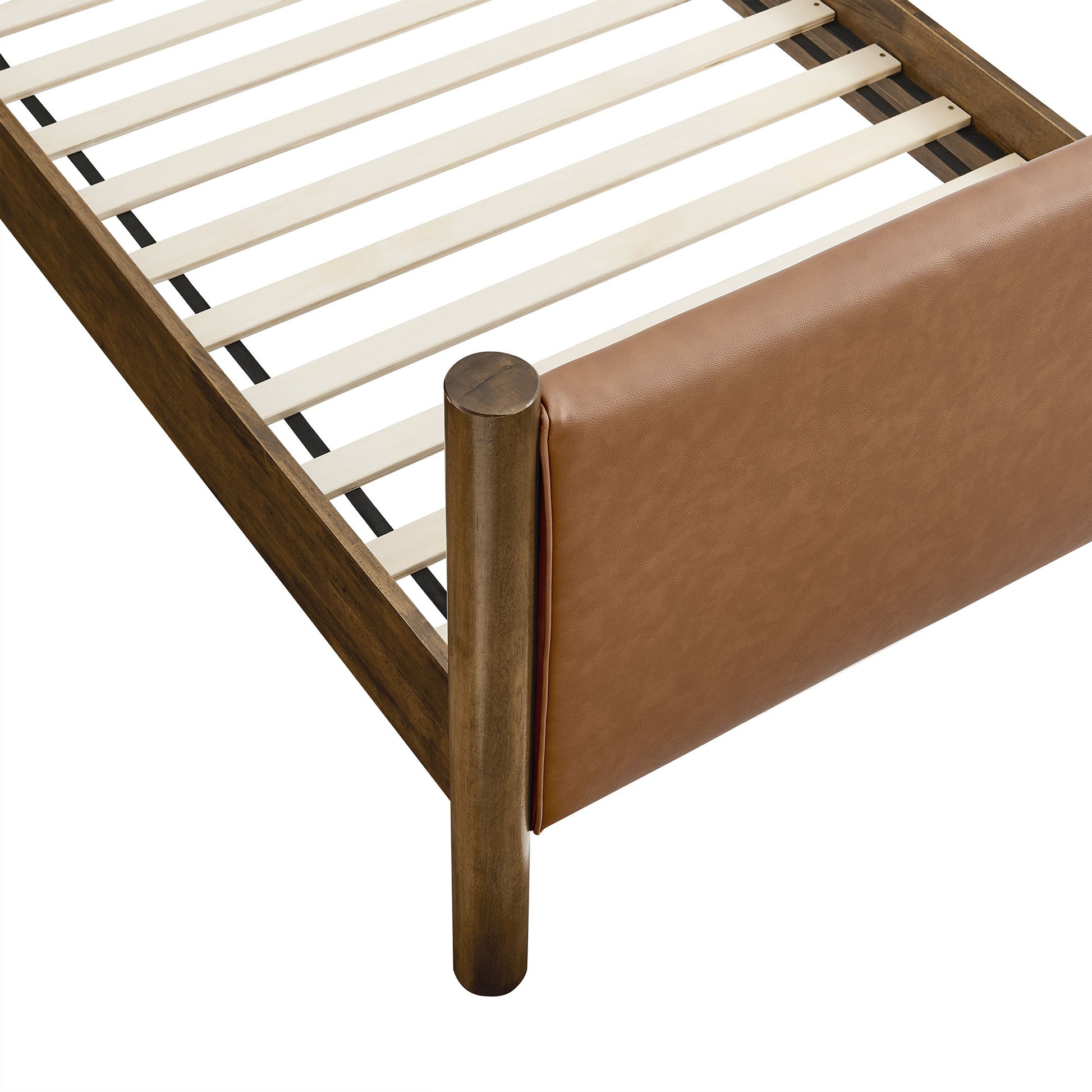 Dark wood platform bed frame with white slats and tan vegan leather upholstered footboard panel.