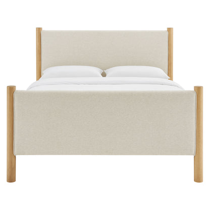 Beige fabric upholstered platform bed with natural oak posts and headboard; clean, modern bedroom centerpiece.