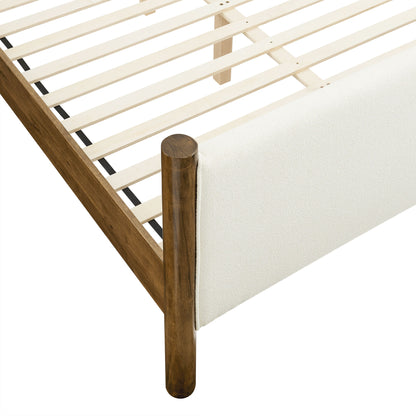 Ivory boucle upholstered platform bed with a slatted base; rounded cylindrical foot post.