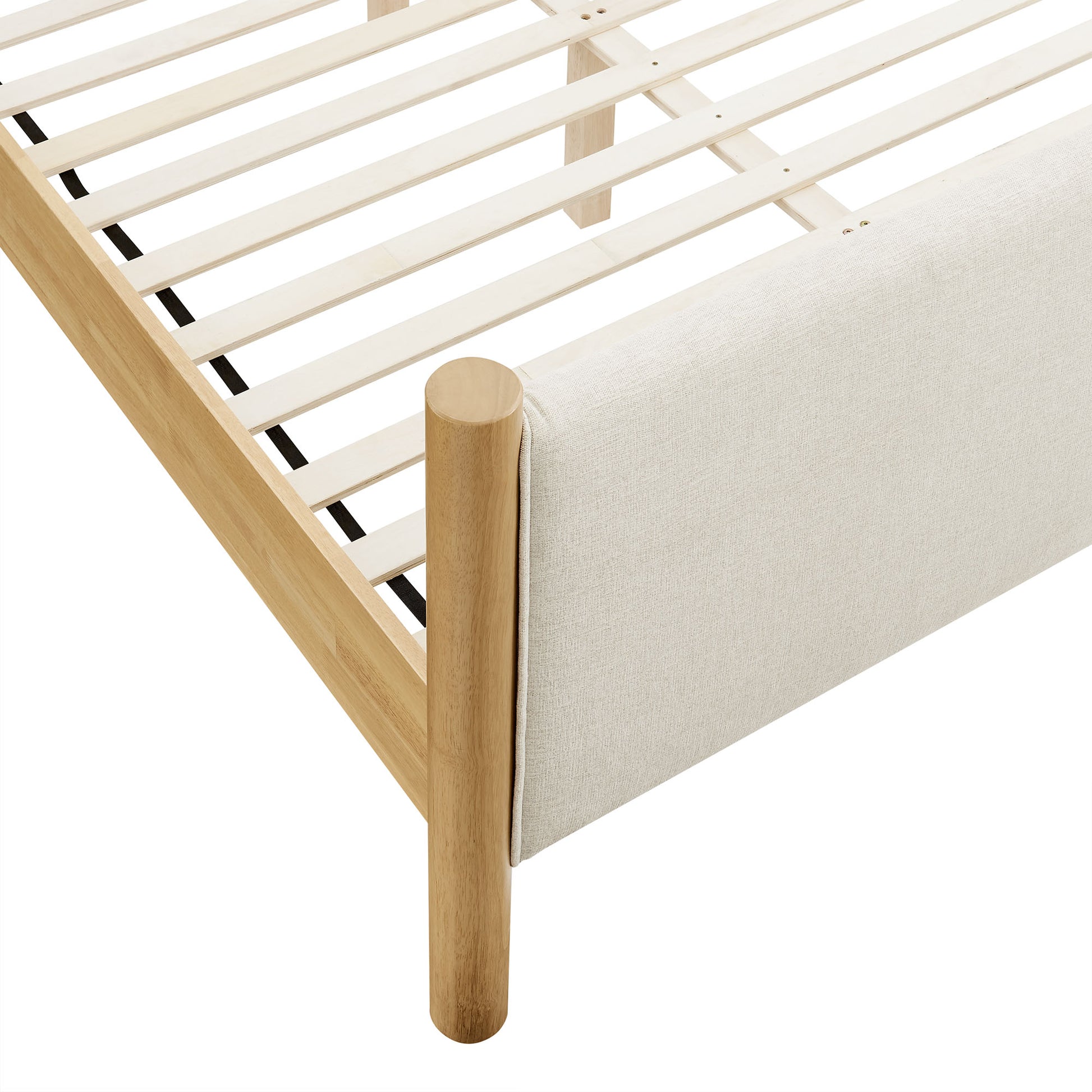 Ivory fabric-upholstered platform bed with a slatted base.