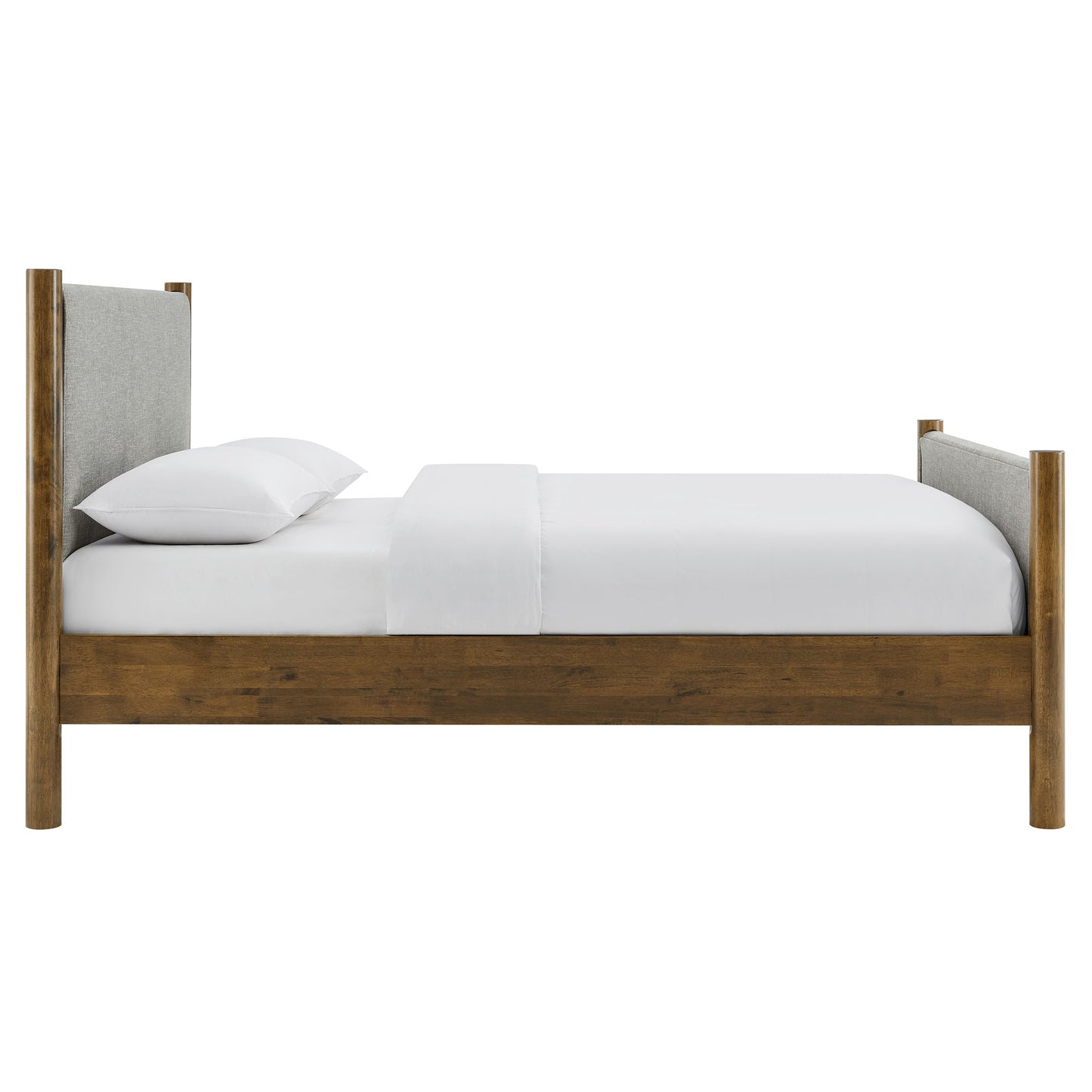 Walnut-finish wooden bed frame with gray upholstered headboard panels & white bedding.