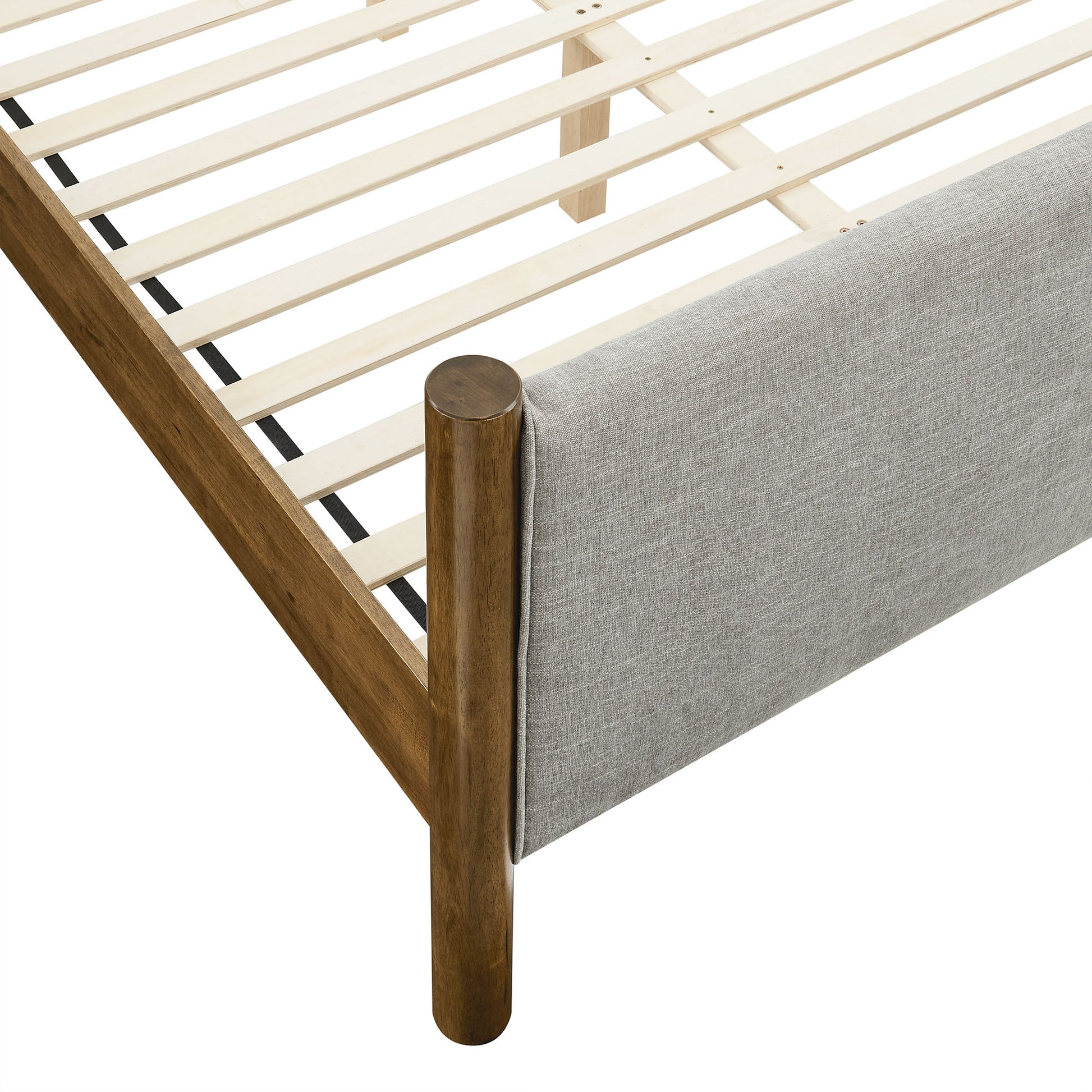 Walnut-finished wooden bed frame with slatted base and gray upholstered end panel.