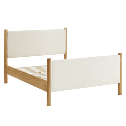 Oak-finish platform bed with ivory boucle upholstered headboard and footboard, slatted base.