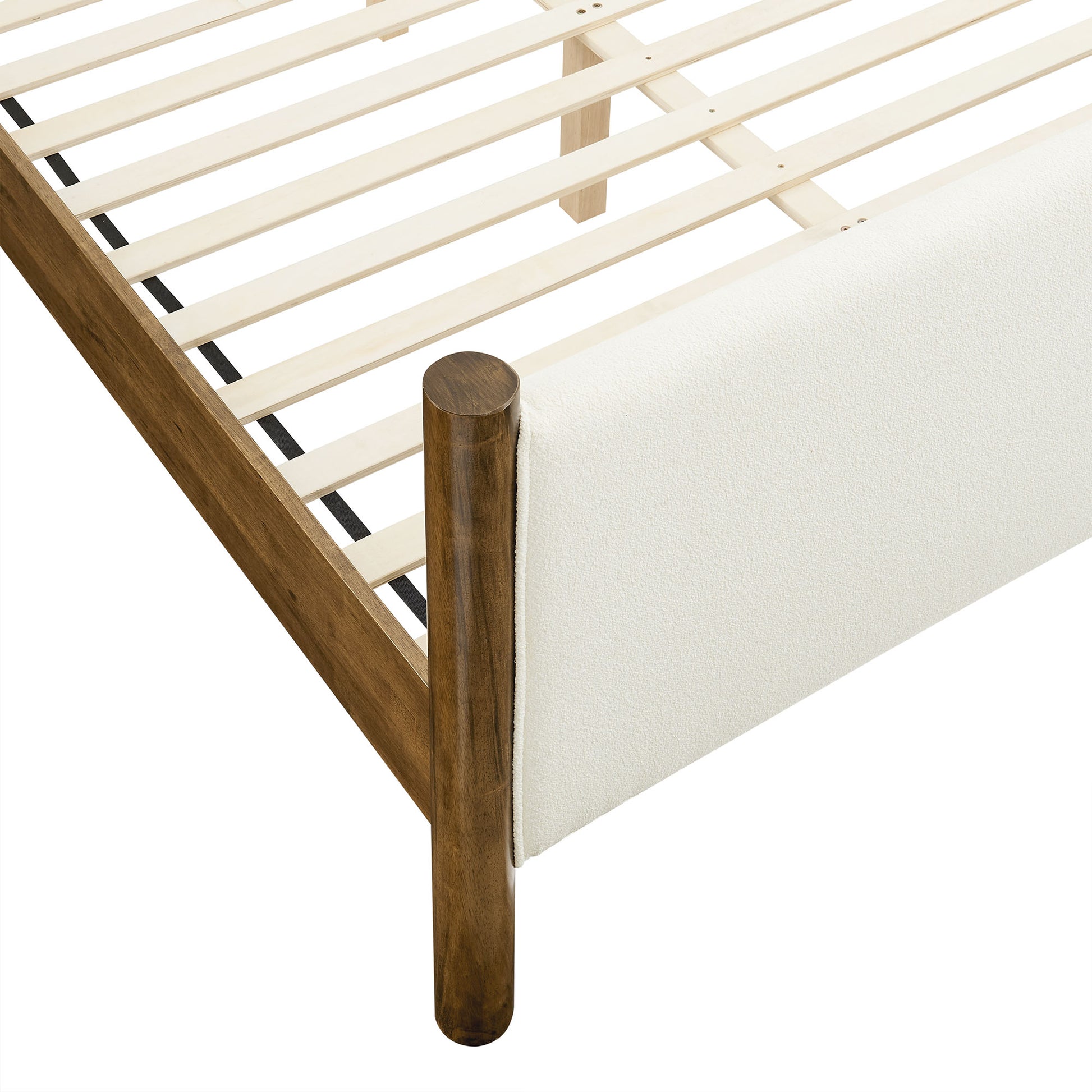 Ivory boucle upholstered king-size platform bed with a slatted base.