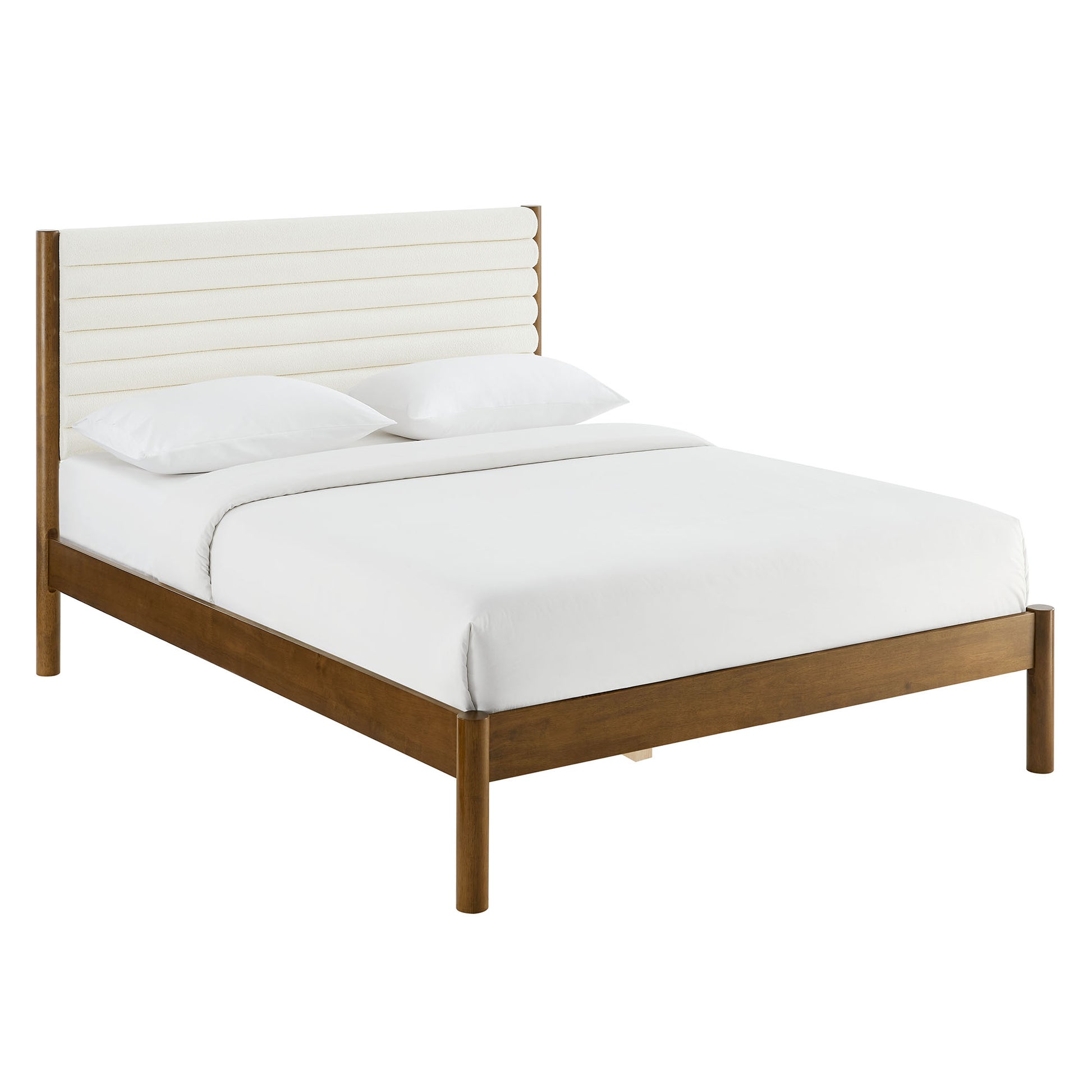 Brown wood full platform bed with an upholstered channel-tufted boucle headboard and white bedding, mid-century modern style.
