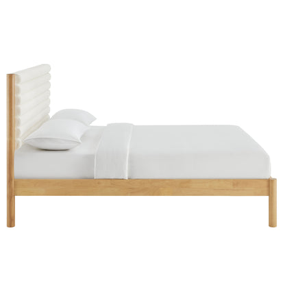 Brown solid wood king platform bed with a tall channel-tufted boucle headboard and crisp white linens in a minimalist style.