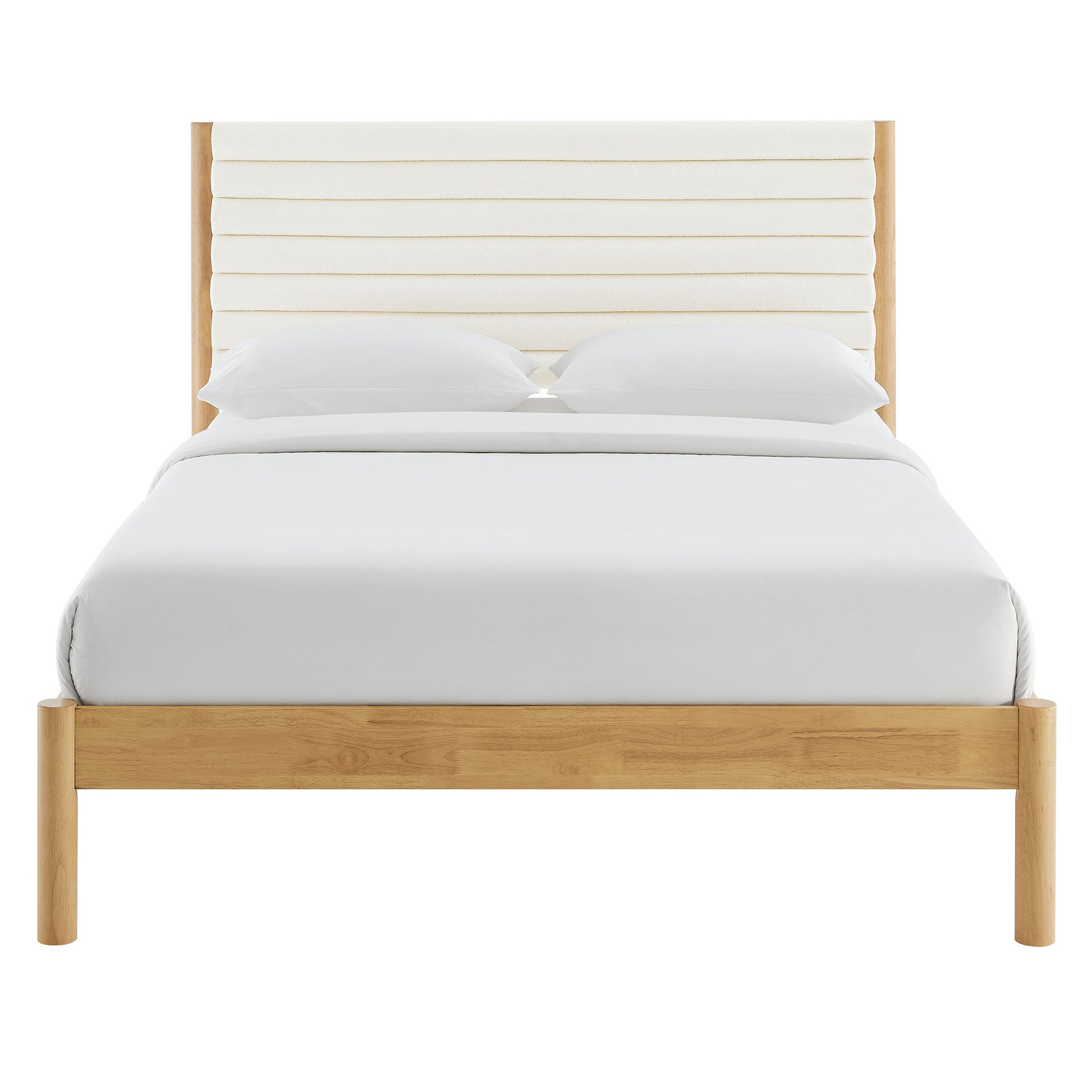 Oak-finish platform bed with padded cream headboard and white bedding.
