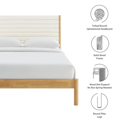 Solid wood king platform bed in natural oak with rounded pillar legs and tufted channel Bouclé headboard, white bedding.
