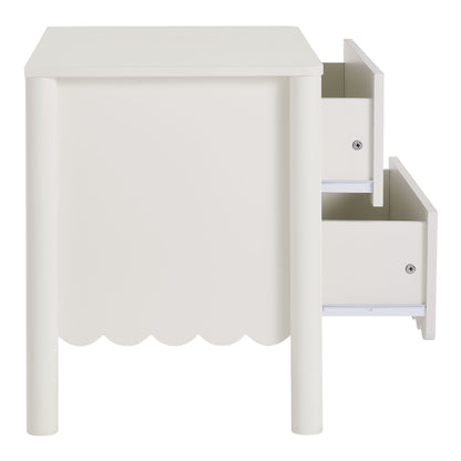 White nightstand with scalloped front skirt, cylindrical legs, and two small right-side drawers with metal knobs.