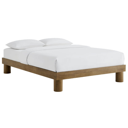 Minimalist platform bed with brown wood frame and white bedding, two pillows, low-profile four legs.