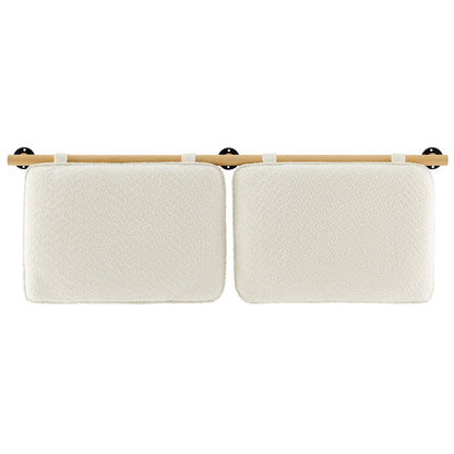 Pair of cream textured cushions mounted on a light wood rod with white loops and black wall brackets.
