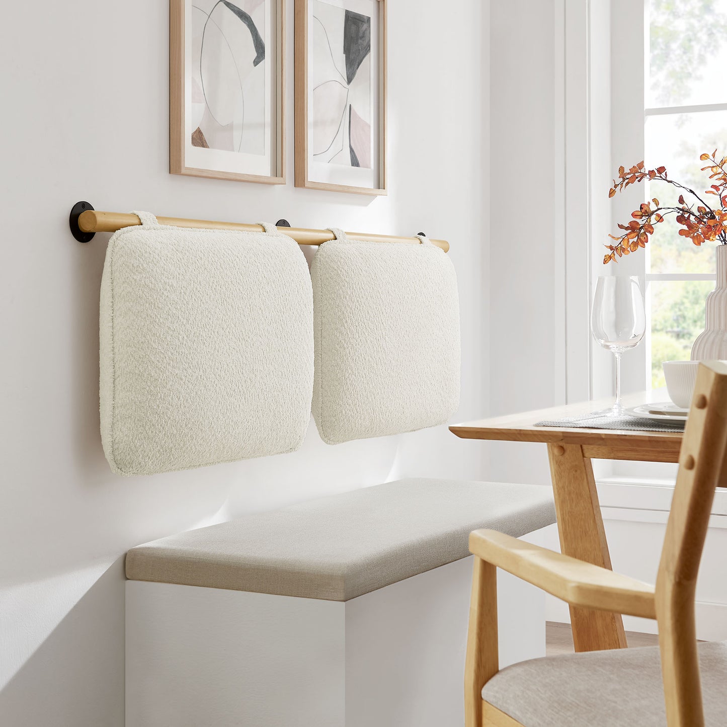 Cream chenille upholstered wall-mounted queen headboard in a bedroom, featuring a soft textured finish.