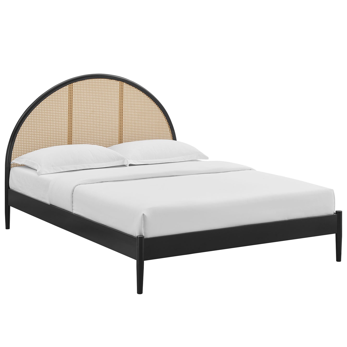 Black arched rattan cane platform bed with a curved headboard and white bedding.