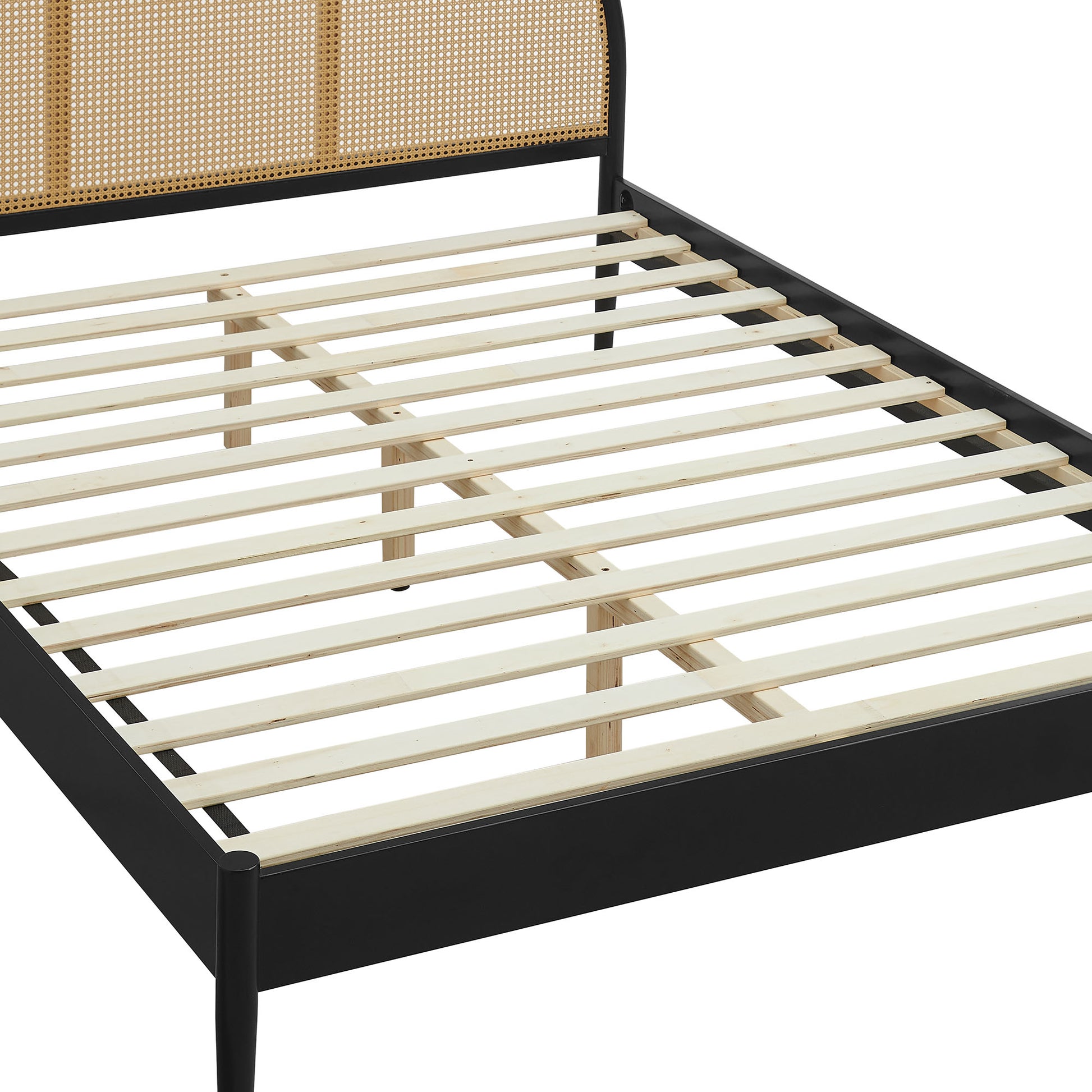 Low-profile black metal bed frame with light wooden slats and a woven rattan headboard panel.