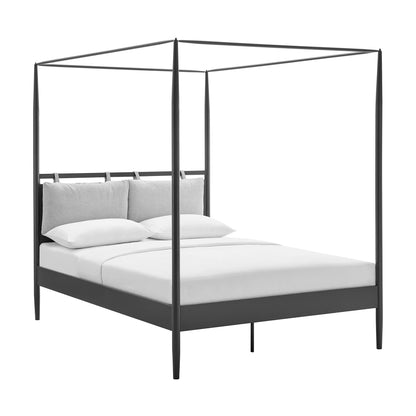Black metal four-poster canopy bed with platform base, white bedding and gray cushions, modern minimalist style.