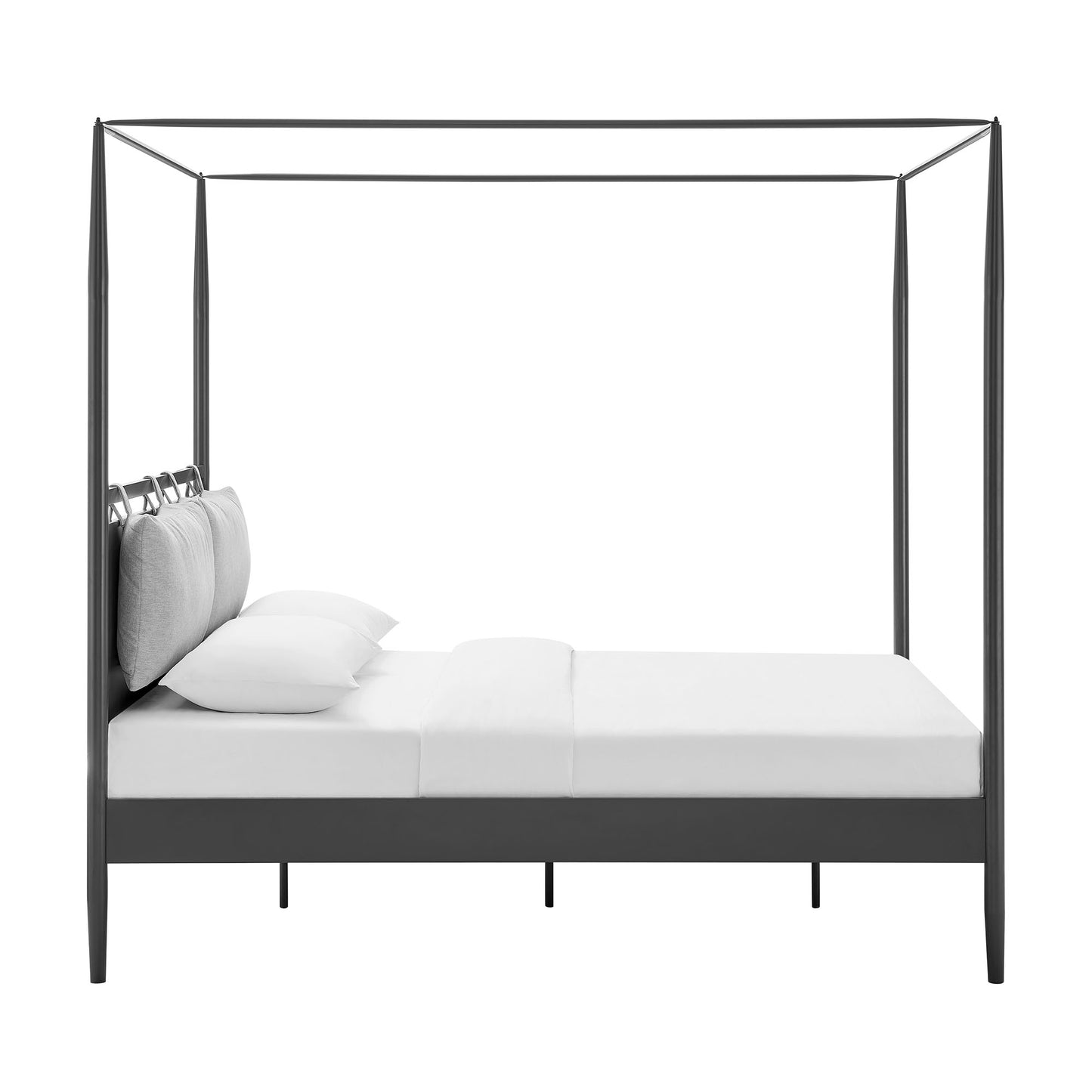 Dark metal four-poster canopy bed with white bedding and gray cushions; modern low platform frame.