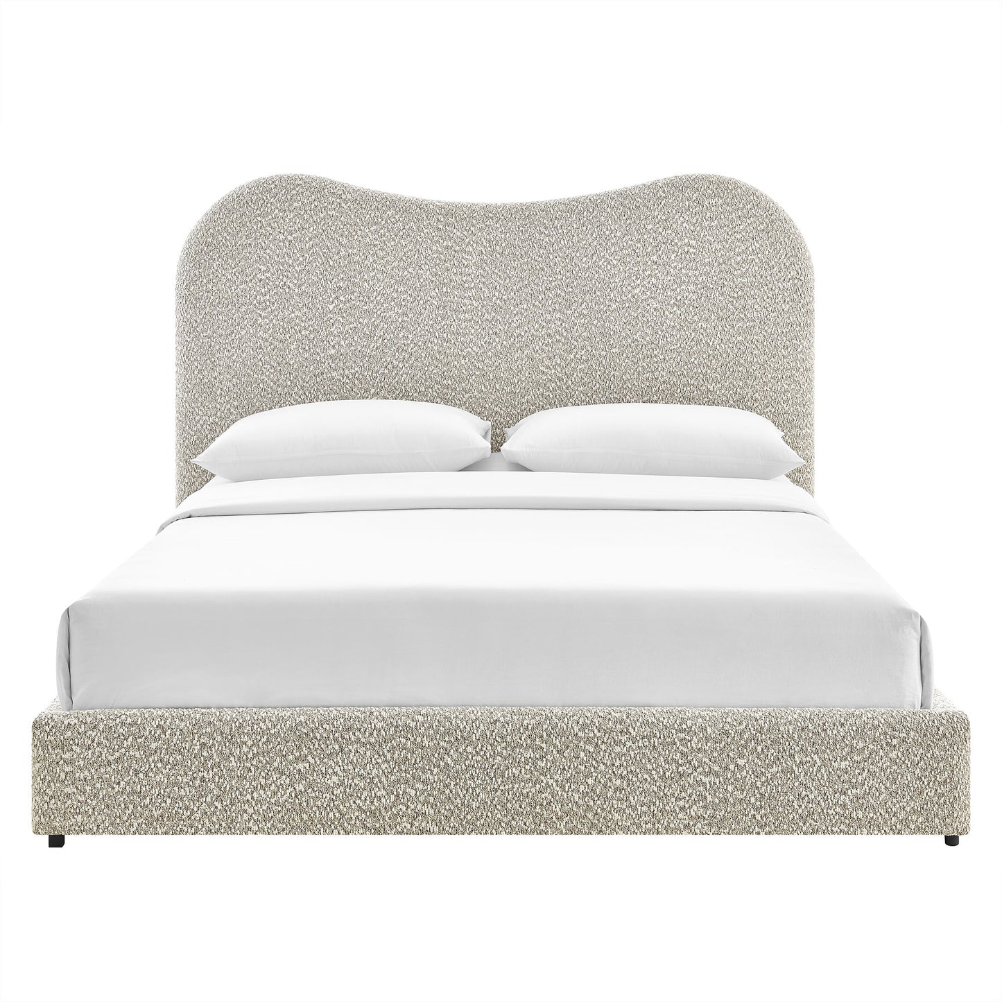 Beige boucle upholstered platform bed with rounded tall headboard and white bedding.