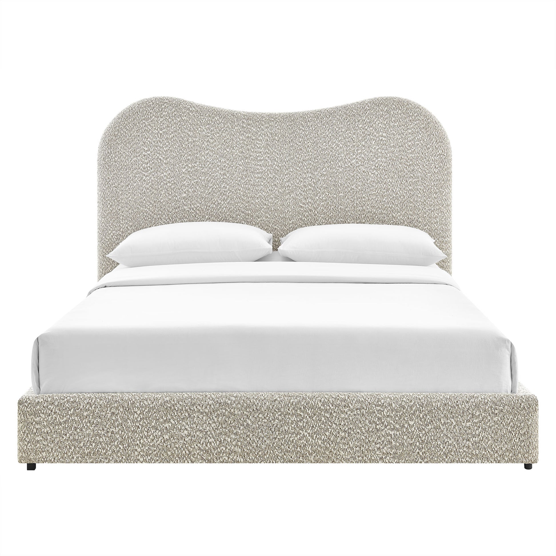 Beige boucle upholstered platform bed with rounded tall headboard and white bedding.