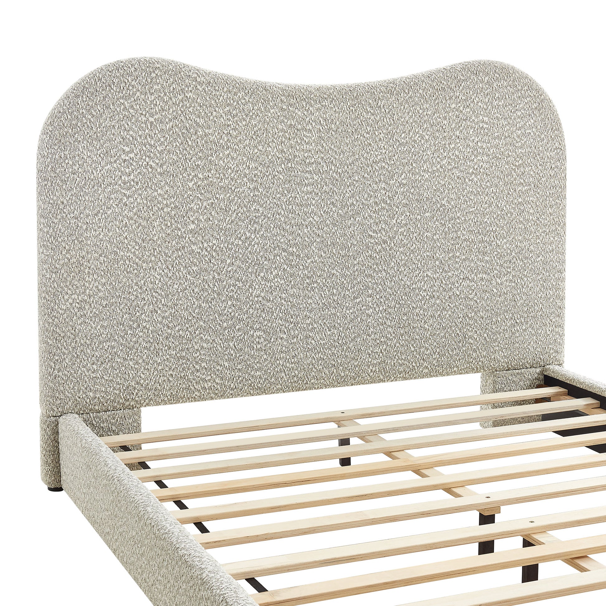 Beige boucle upholstered bed frame with curved headboard & wooden slat base.