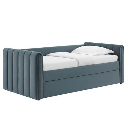 Teal velvet bed with tall vertical-channel side rails and headboard, two twin mattresses with white bedding.