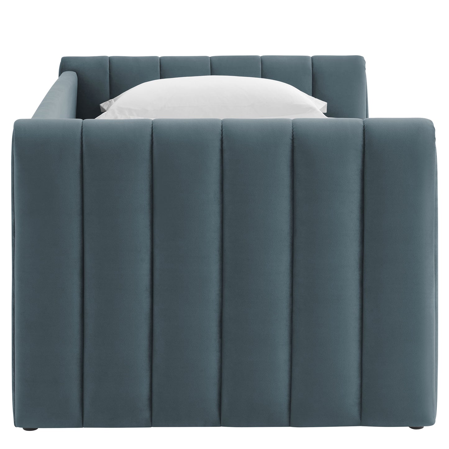 Cadet blue twin daybed with trundle, upholstered in channel-tufted performance velvet, with tall vertical panels and a white pillow.