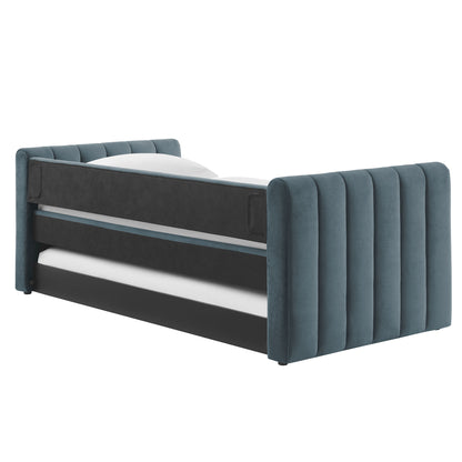 Blue velvet bed with tall, vertical channel-tufted headboard & footboard; dark rails, modern glam.