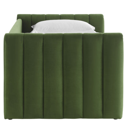 Moss green velvet daybed with tall vertical channel-tufted sides and a white pillow.