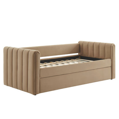 Taupe upholstered daybed sofa with vertical channel tufting on arms and back, slatted bed base.