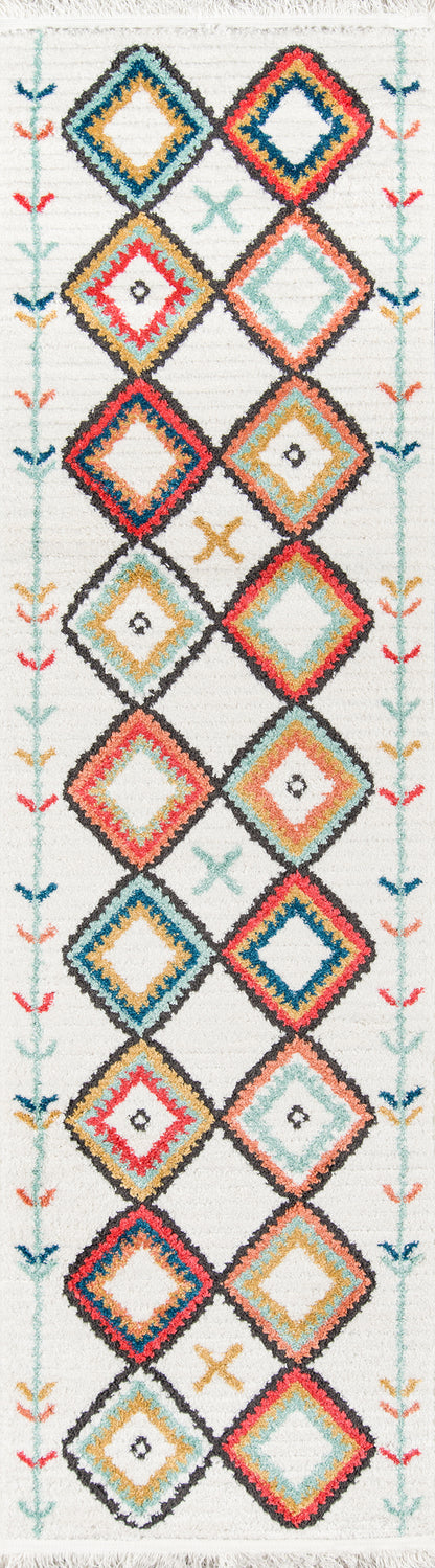 Boho rug with stacked diamond motifs in turquoise, coral, yellow on white; pastel side borders and fringed ends.