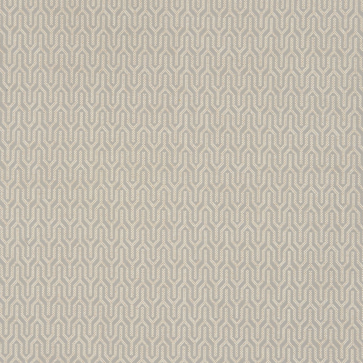 Beige background with a grey/silver interlocking geometric chain pattern on twill fabric; retro-modern.