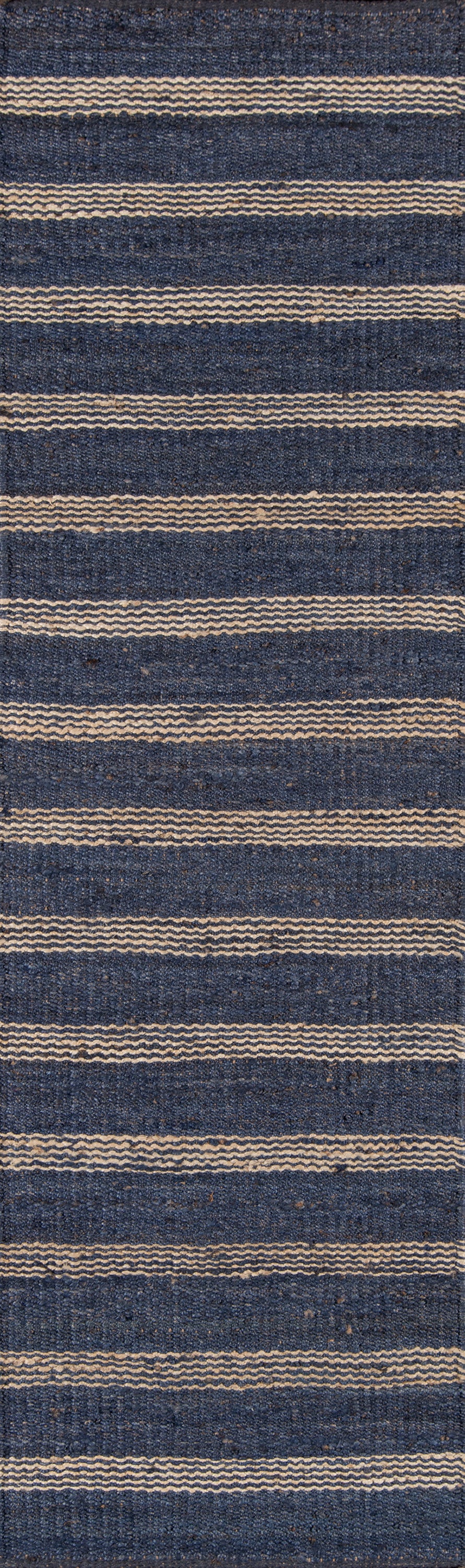 Navy blue woven rug with cream wavy stripes and textured surface.