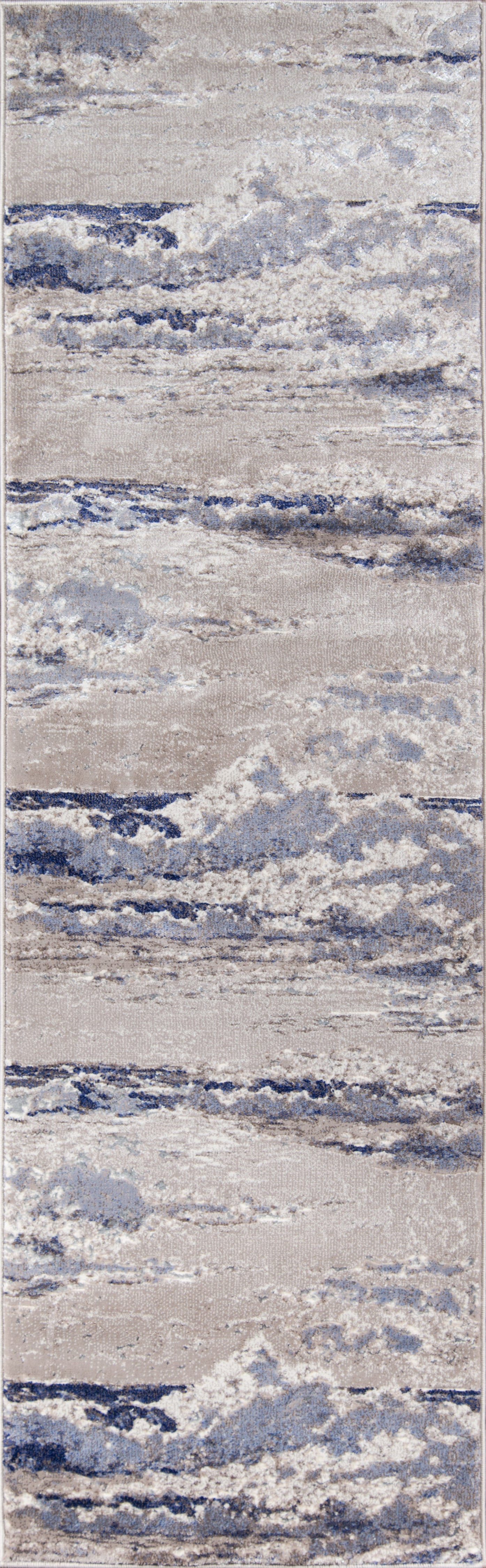 Rectangular area rug with abstract blue, gray and beige pattern; soft textured pile for modern coastal decor.