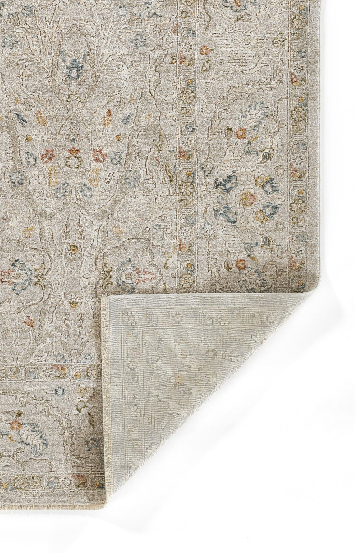 Beige oriental area rug with pastel floral medallions, intricate border, folded corner reveals woven back.