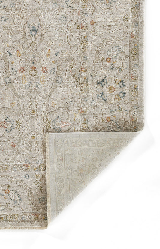 Beige oriental rug with subtle floral pattern, blue and pink accents, ornate border, folded corner reveal.