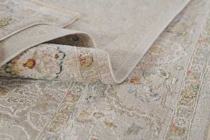 Beige vintage-style rug with faded floral medallion pattern and soft pile for living room decor.