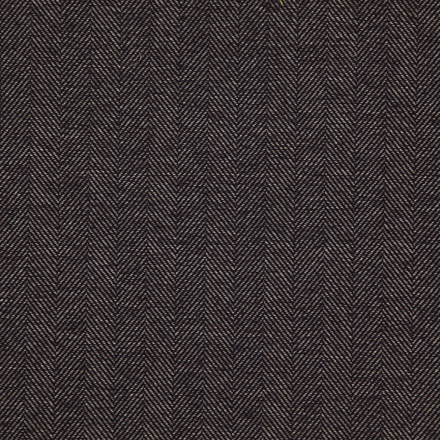 Dark brown herringbone jacquard fabric close-up with tan highlights and a rich textured wool look.