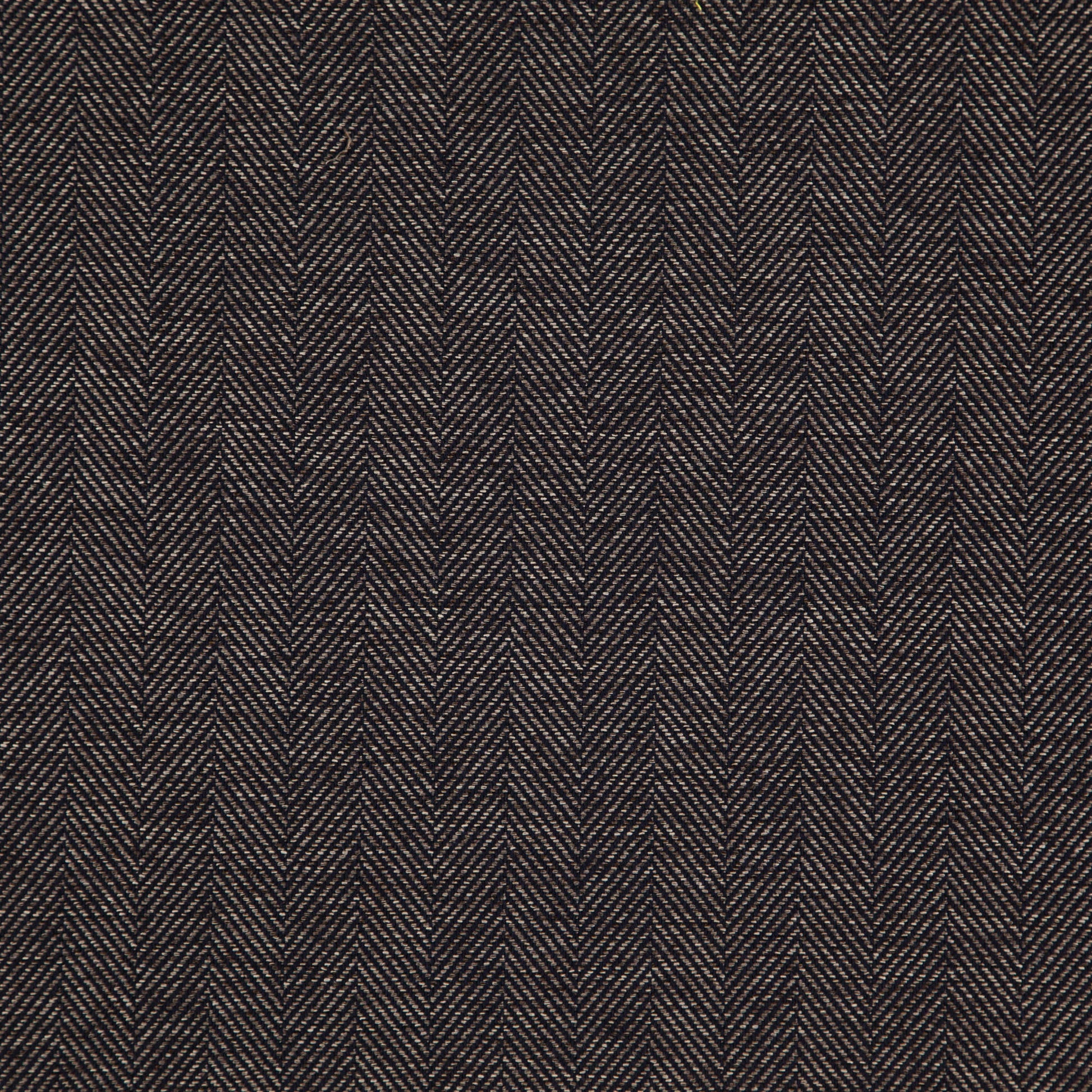 Dark brown herringbone jacquard fabric close-up with tan highlights and a rich textured wool look.
