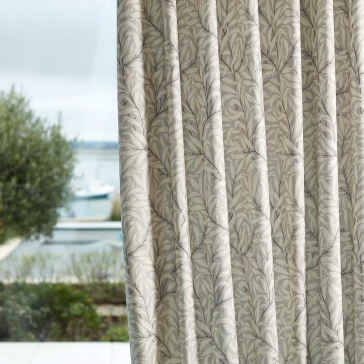 Morris & Co Pure Willow Boughs wide-width fabric in grey showing entwining willow-leaf and stem motif, extra-wide width suitable for drapes and upholstery projects.