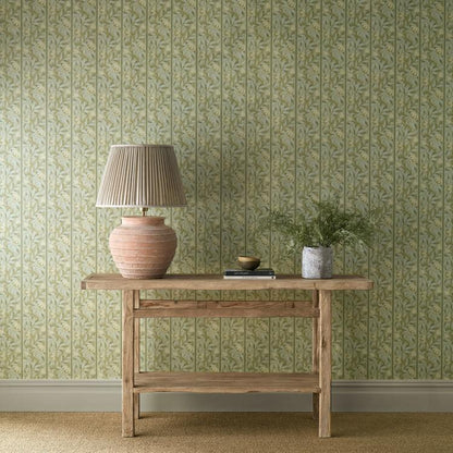 Sage green Peony Trellis Wallpaper by Morris & Co. featuring elegant climbing vines, stylized peony flowers, and a subtle ogee stripe. Perfect for feature walls, bedrooms, living rooms, and classic English-inspired interiors.