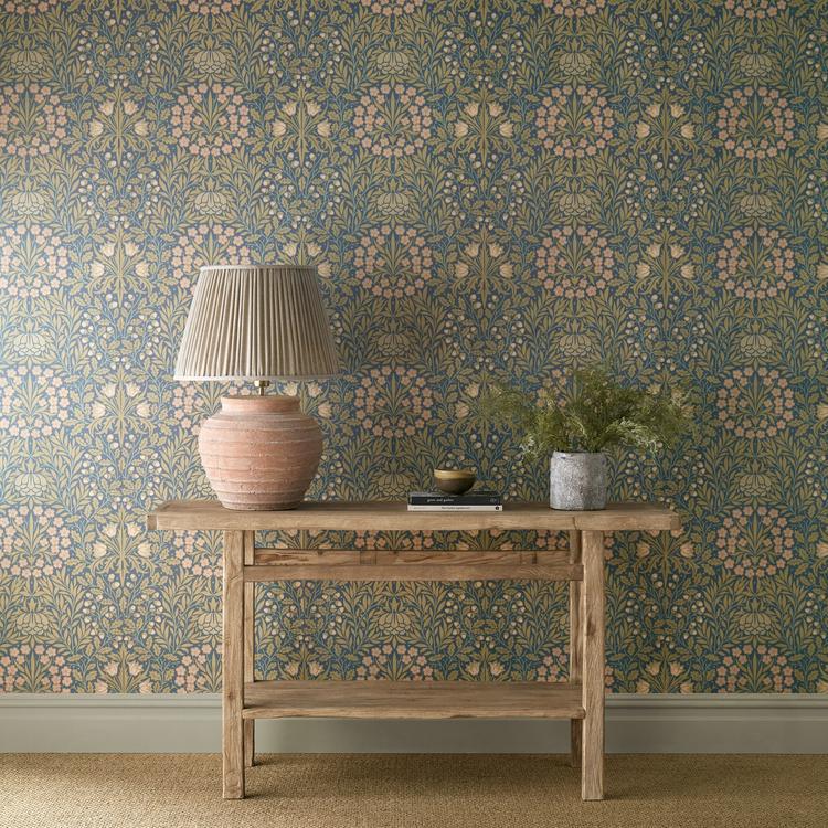 William Morris Daisy & Oak Wallpaper in Powder Blue/Blush by Morris & Co featuring delicate daisies, graceful tulips, and signature acorn motifs in soft powder blue and blush pink tones. This timeless botanical wallpaper adds classic Arts & Crafts charm to living rooms, bedrooms, dining rooms, hallways, nurseries, and elegant feature walls.